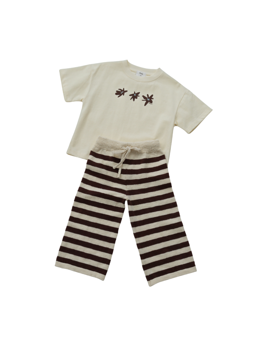 Children's outfit with a white shirt and brown striped pants on a white background